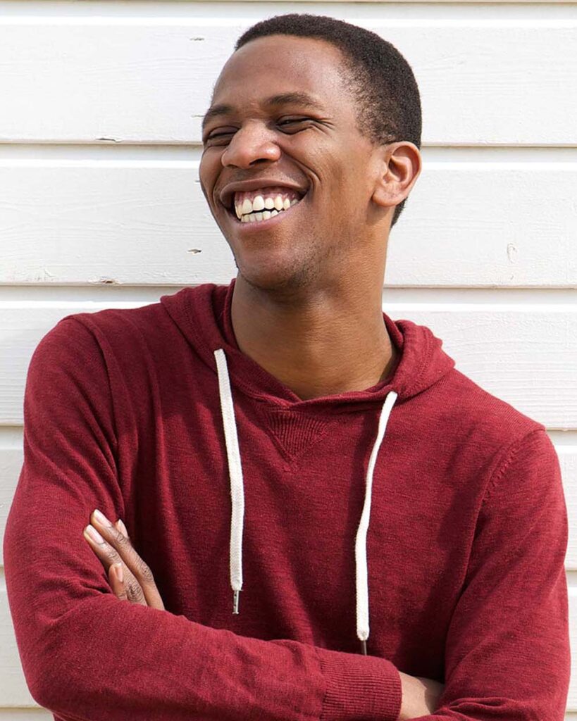 portrait of a young african man laughing pnunsp5.jpeg